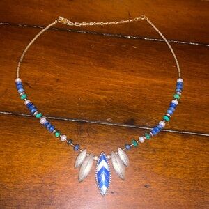 Blue beaded turquoise with silver feathers in blue inlay feather.